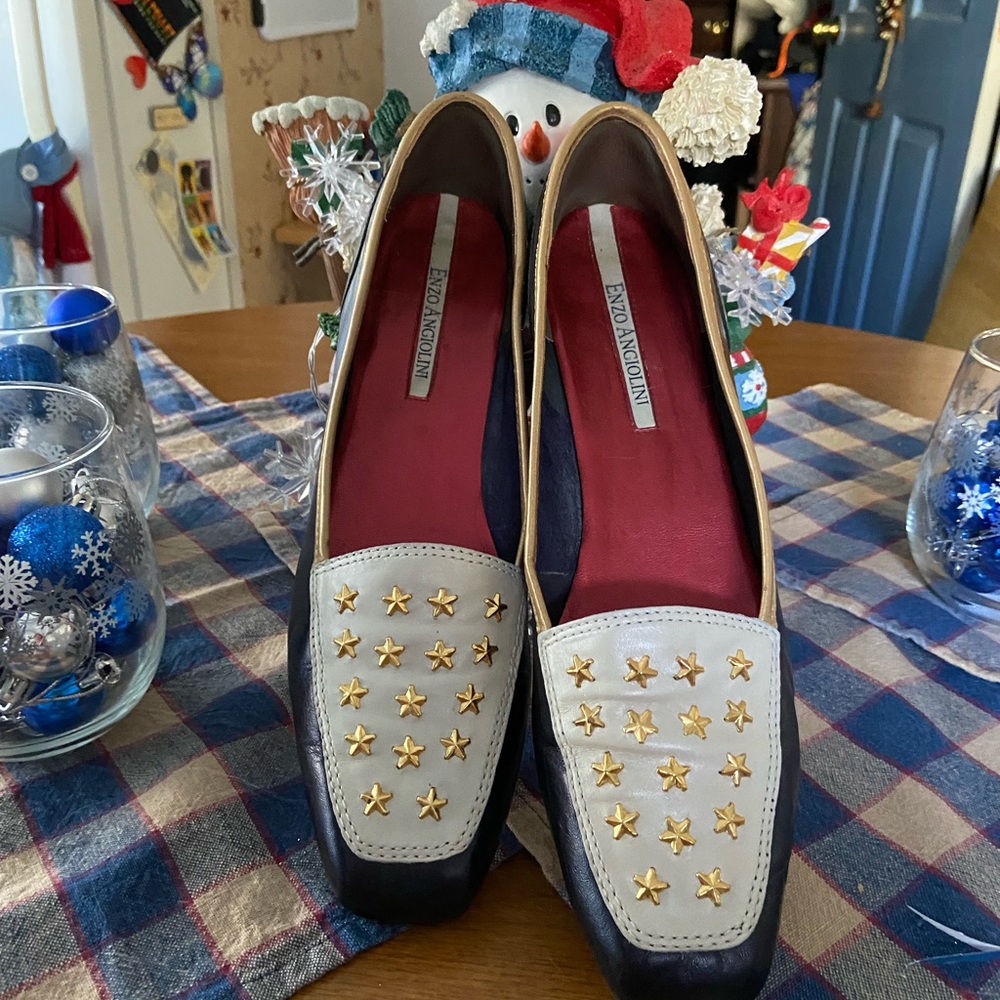 Enzo Angiolini blue multi slip-one embellished with stars on top.